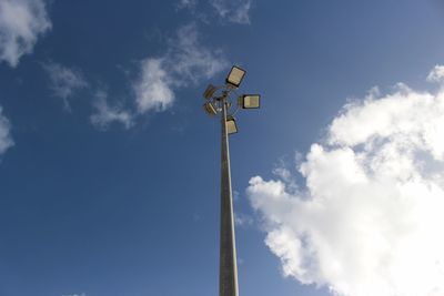 Low angle view of floodlight against sky