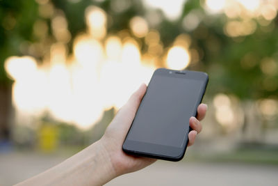 Close-up of hand using mobile phone