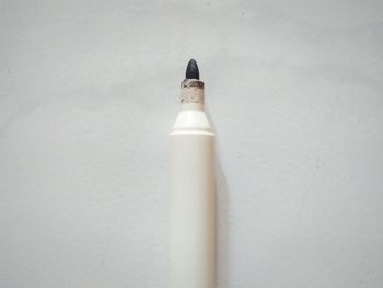 High angle view of pen on table against white background