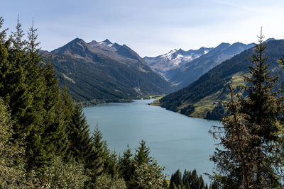 Scenic view of lake and mountains against sky