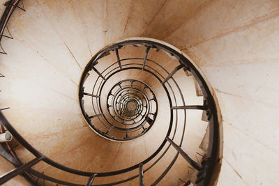 Directly below shot of spiral staircase of building