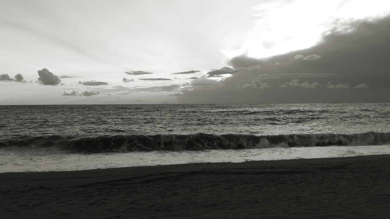 sea, beach, water, shore, horizon over water, sand, scenics, sky, wave, beauty in nature, tranquil scene, tranquility, nature, surf, idyllic, cloud - sky, coastline, sunlight, remote, sunbeam