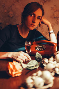 Portrait of a young woman drinking