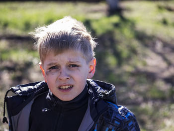 Portrait of boy with soot smear on face