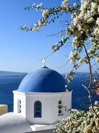 Low angle view of white building against blue sky