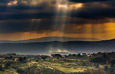 Scenic view of mountains against cloudy sky