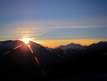 Scenic view of mountains against sky during sunset