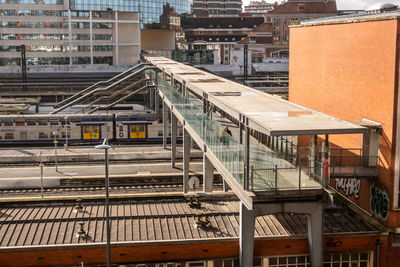 High angle view of railroad tracks amidst buildings in city