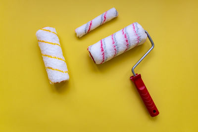 High angle view of cupcakes on yellow background