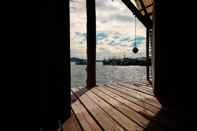 View of the sea as seen from inside a wooden bungalow