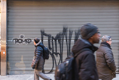 Side view of people walking on street