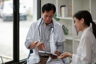Doctor examining patient at clinic