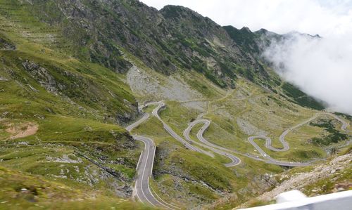 High angle view of road amidst mountains against sky