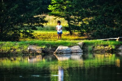 Child by pond