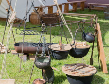 Close-up of clothes hanging on wood in field