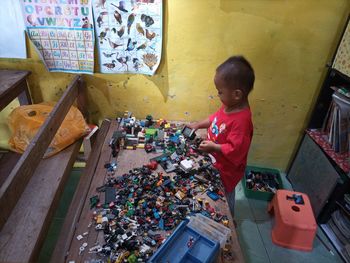 A boy playing with legos