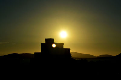 Scenic view of silhouette building against clear sky