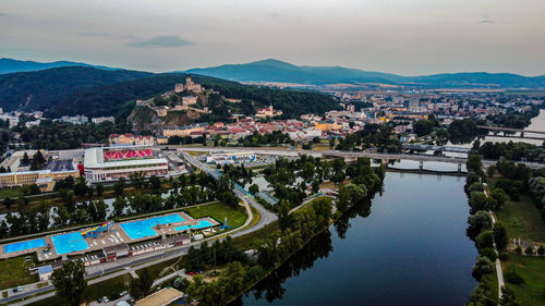 High angle view of river and buildings in city