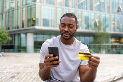 Young man using mobile phone