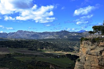 Scenic view of landscape against cloudy sky