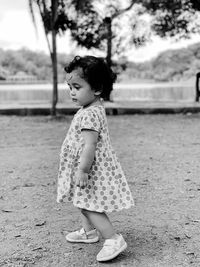 Full length of girl standing on field