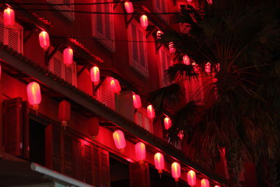 Low angle view of illuminated building at night