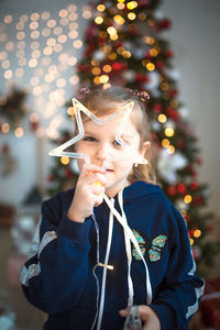 Portrait of boy with christmas tree