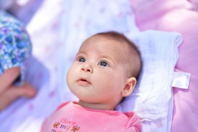 Cute baby lying on bed