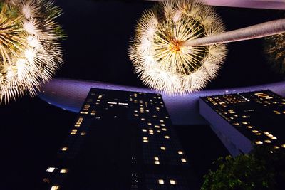 Low angle view of illuminated building at night