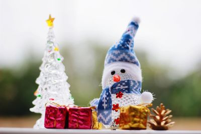 Close-up of figurine on wood