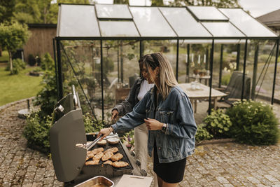 Women having barbecue in garden