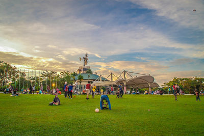 People on field against sky