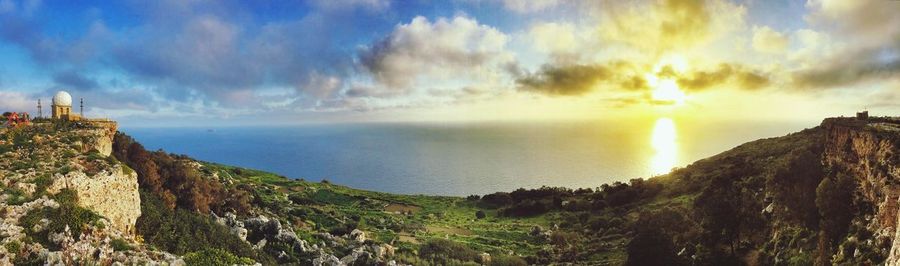 Scenic view of sea against cloudy sky