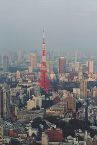 Cityscape against sky. view over tokyo tower from mori tower, roppongi hills, tokyo, japan