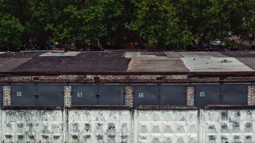 High angle view of buildings against trees
