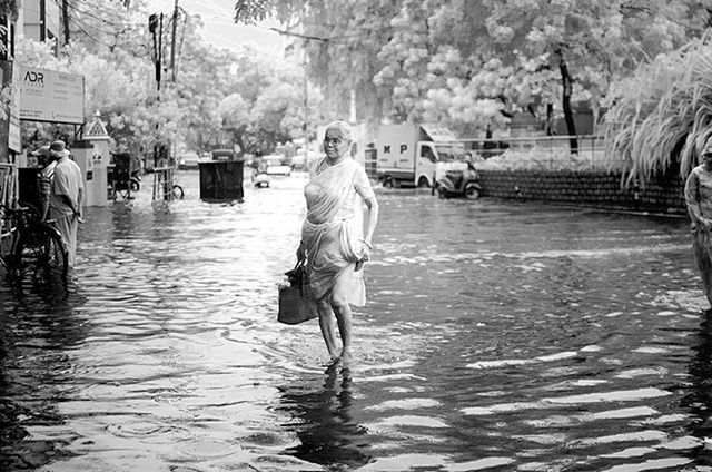 water, tree, lifestyles, full length, leisure activity, rear view, waterfront, men, casual clothing, standing, day, river, outdoors, person, built structure, walking, building exterior, lake