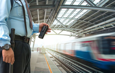 Blurred motion of train at railroad station