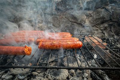 Close-up of food sossages on barbecue