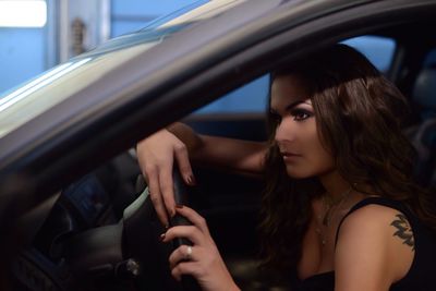 Close-up of woman sitting in car