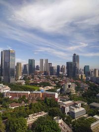 High angle view of buildings in city against sky