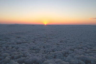 Scenic view of sea against clear sky during sunset