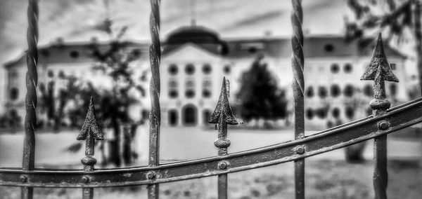 Close-up of metal railing against building