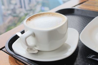 Close-up of cappuccino on table