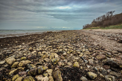 Scenic view of sea against cloudy sky