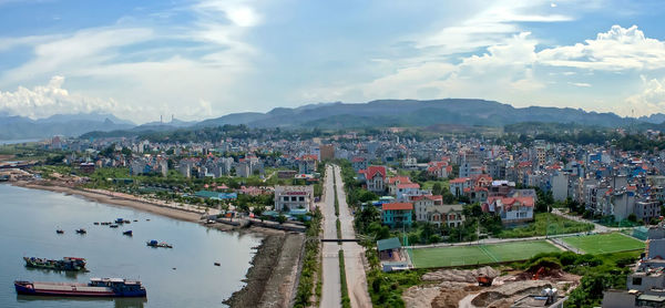 High angle view of city and buildings against sky