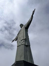 Low angle view of statue against cloudy sky