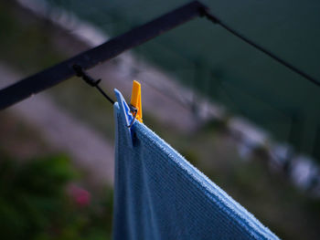 Close-up of towel hanging on clothesline