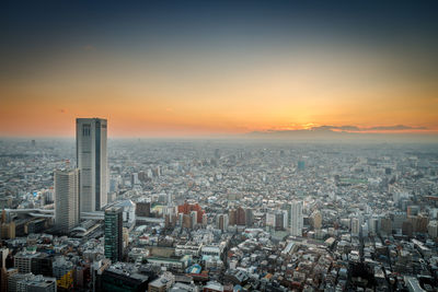 Aerial view of city at sunset