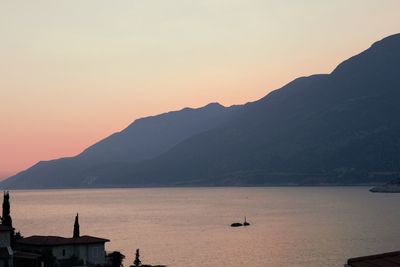 Scenic view of silhouette mountains against sky during sunset