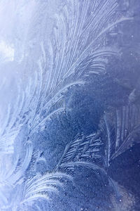 Full frame shot of snow covered glass window
